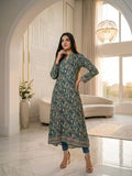 Woman in a green patterned dress 